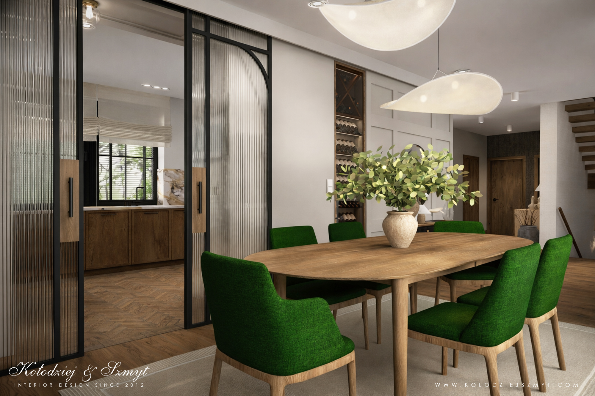 Kuchnia i jadalnia połączone szklanymi przesuwnymi drzwiami z ryflowanego szkła